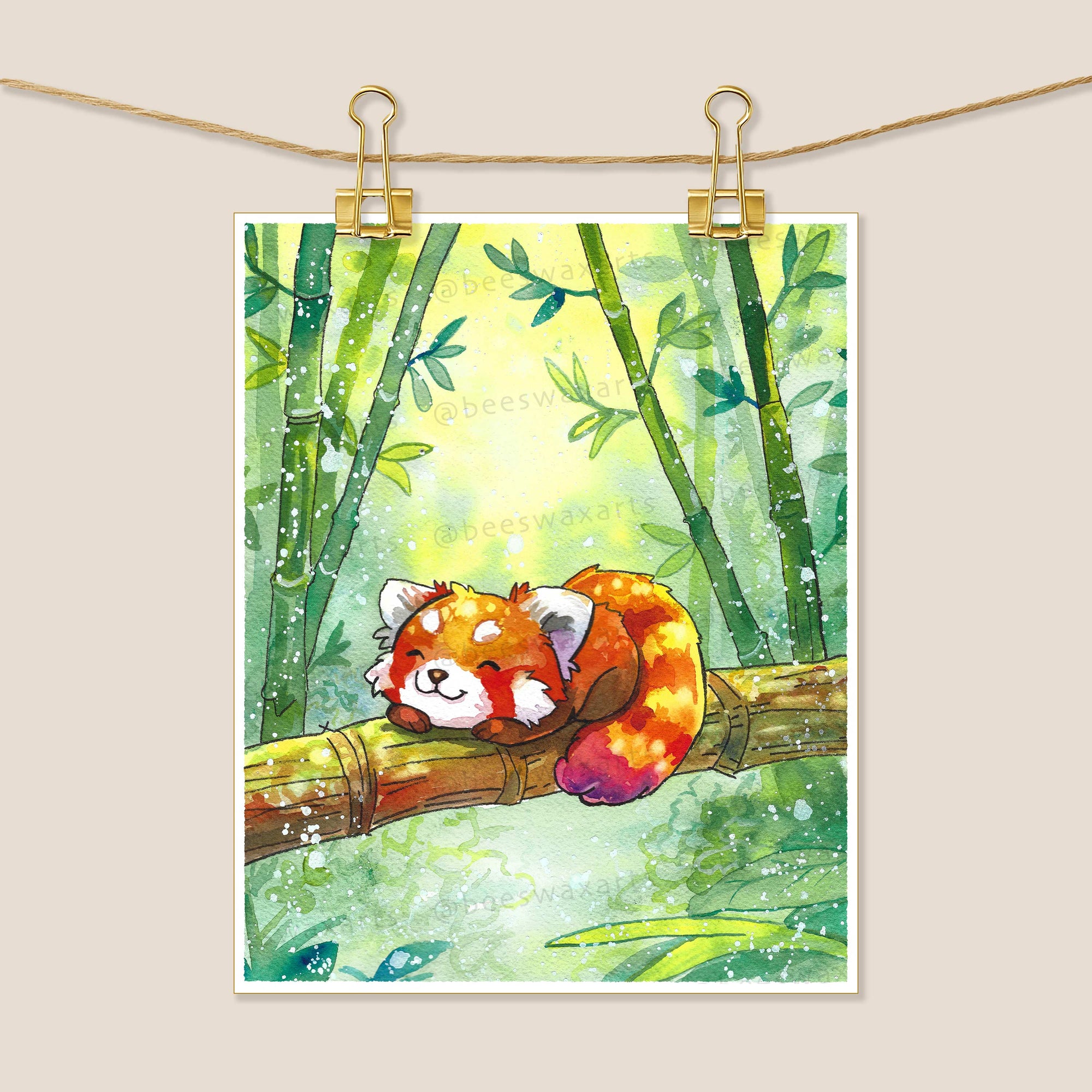 Red Panda in the Bamboo by Beeswax Arts Watercolors features a red panda asleep on a bamboo branch in a verdant forest, glowing as light filters through. A charming collectors print, perfect for nature lovers.